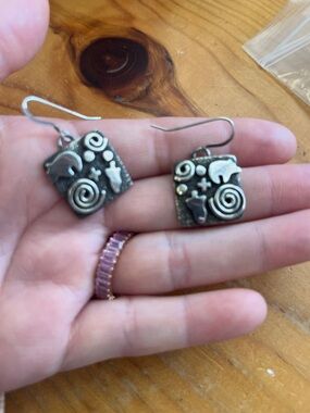 silver Handcrafted Animal Motif Dangle Earrings by alex sanchez